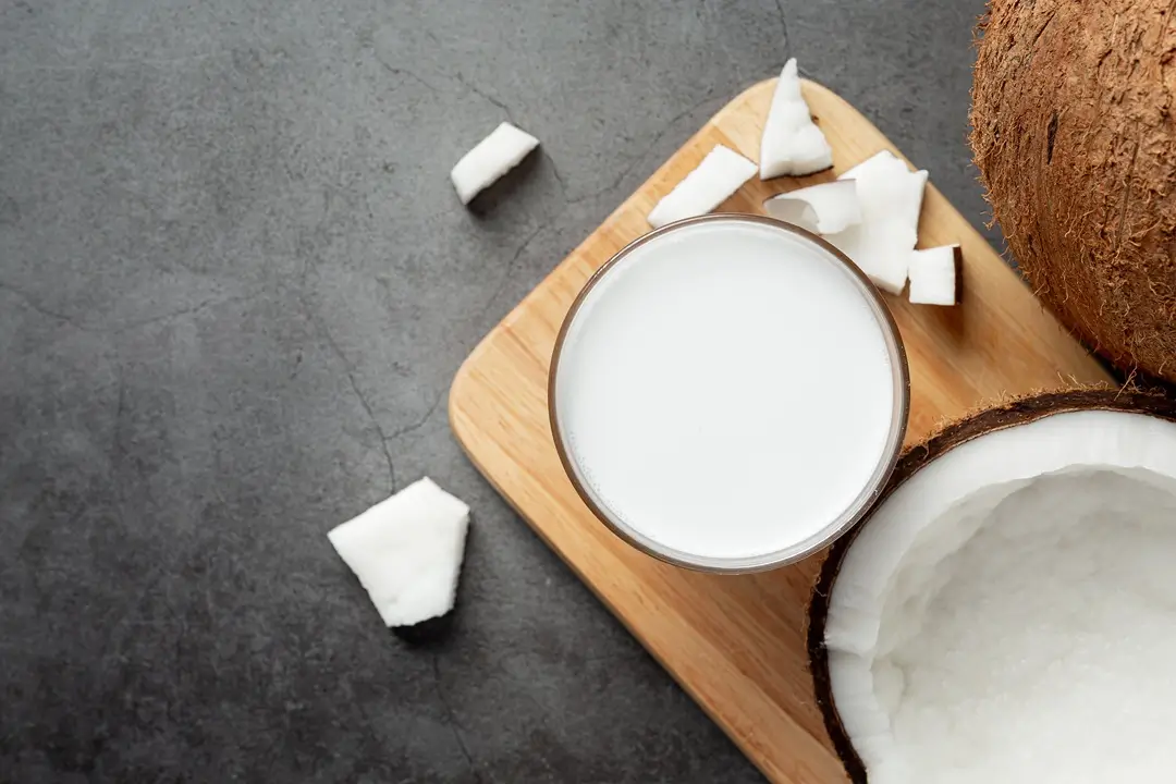 glass-coconut-milk-put-wooden-cutting-board