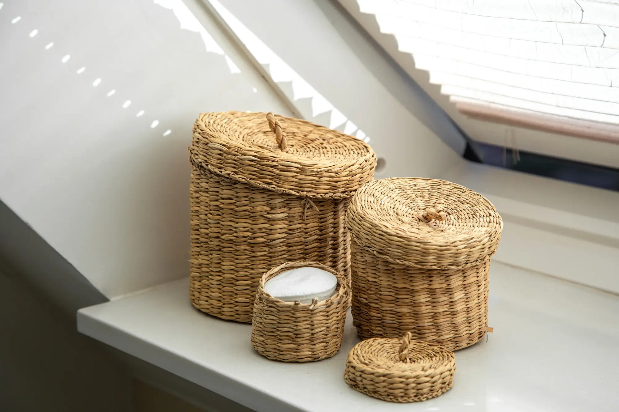 three-wicker-boxes-cosmetics-personal-care-items-bathroom