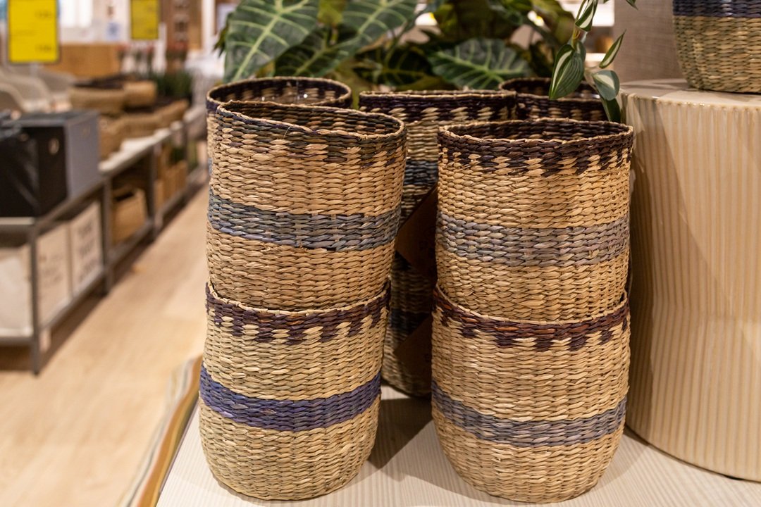Wicker baskets for the home on a store display. A wicker straw basket in a home goods store.