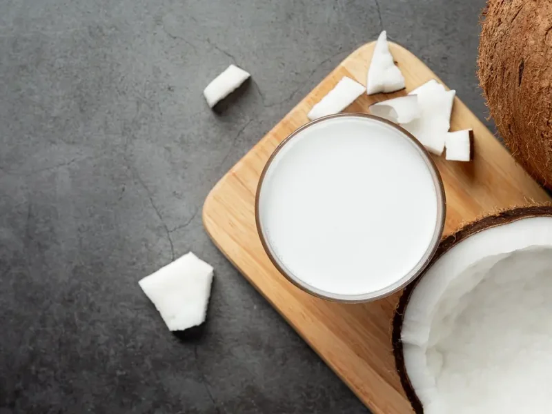 glass-coconut-milk-put-wooden-cutting-board